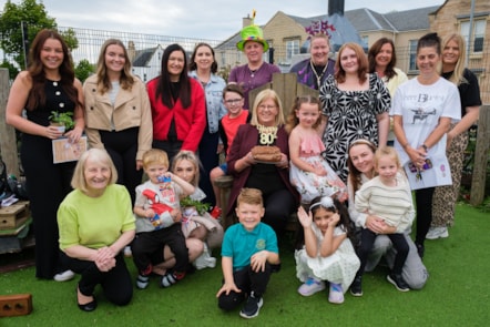 Margaret Blades (centre) with staff and guests at the 80th birthday celebrations