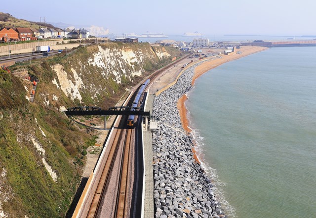 Dover - Shakespeare Beach: A train passes under the new Wellards Way footbridge at Dover - Shakespeare Beach