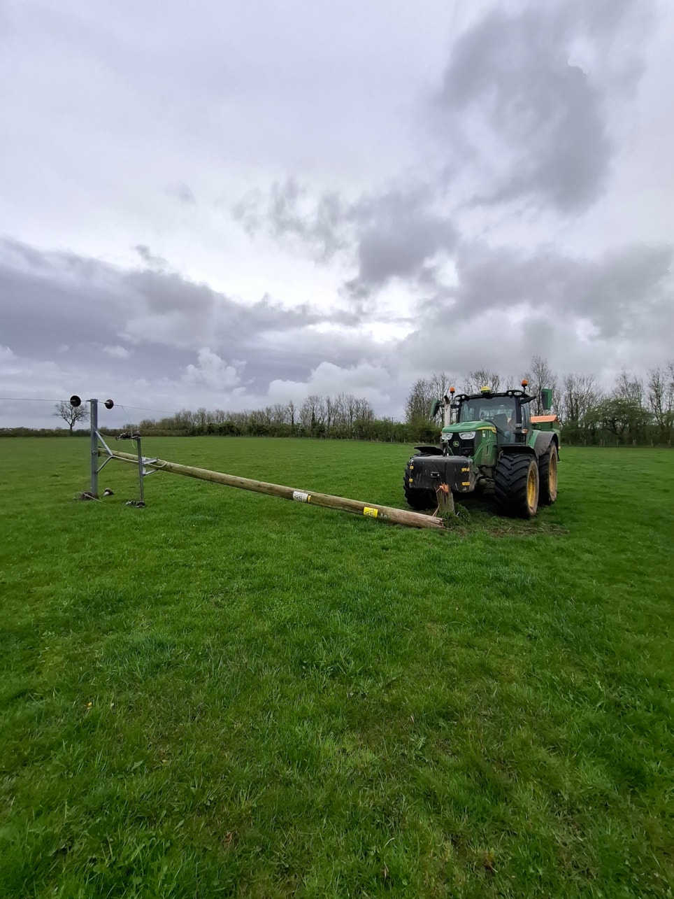 Snapped pole after hit by a tractor