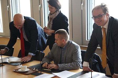 Paul McMahon at RFC North Sea – Med extension signing ceremony in Luxembourg: Paul McMahon (Network Rail), the notary, Michel Geubelle (Infrabel) 
and Guillaume Confais-Morieux (RFC North Sea – Med)
Freight