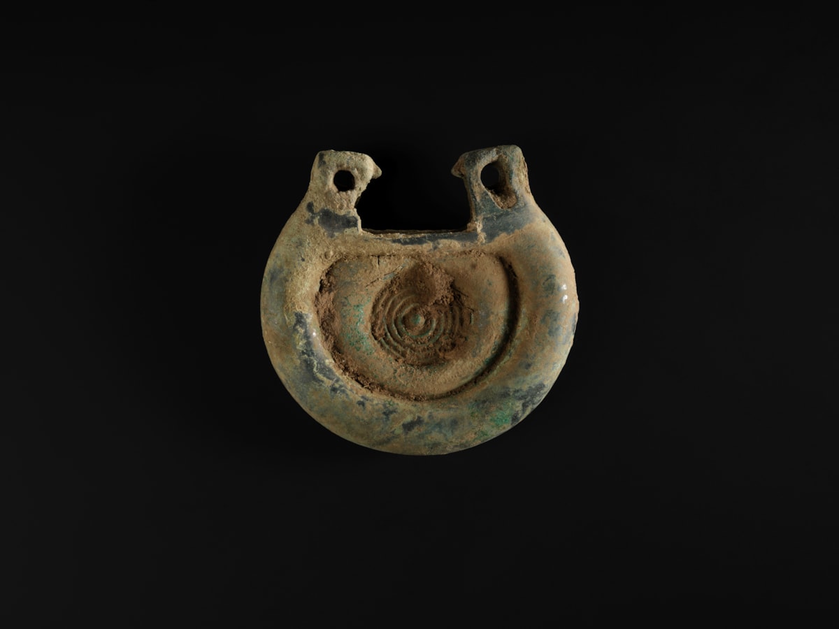 08. A decorated bronze fitting from the Bronze Age Peebles Hoard Image (c) National Museums Scotland