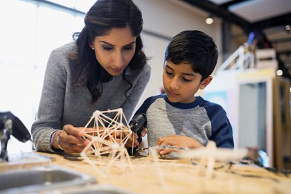 Don't follow in my footsteps, kids told: mother-and-son-assembling-toothpick-model-at-a-science-center-india original