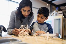 mother-and-son-assembling-toothpick-model-at-a-science-center-india original