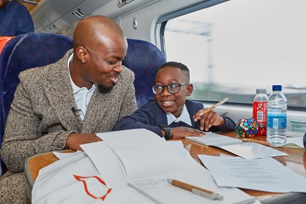 Feel Good Field Trip - London Experience (3): George The Poet with pupil from Ashbury Meadow School on the way to London.