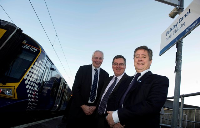 Paisley Canal 1: Scotland route managing director David Simpson, centre, is joined by ScotRail MD Steve Montgomery, left, and Transport Minister Keith Brown to welcome one of the new 380s to Paisley Canal on the first day of all-electric services.