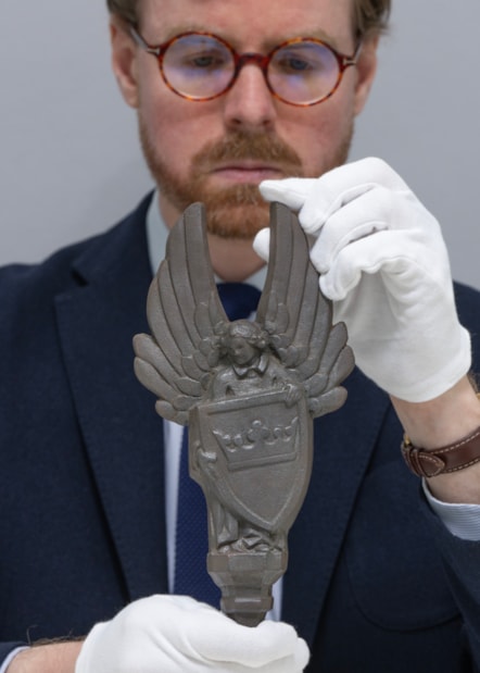National Museums Scotland Curator Dr Calum Robertson with the cast iron angels. Image (c) Neil Hanna (2)