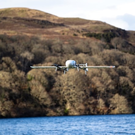 A plane flying over a body of water  Description automatically generated with medium confidence (2)