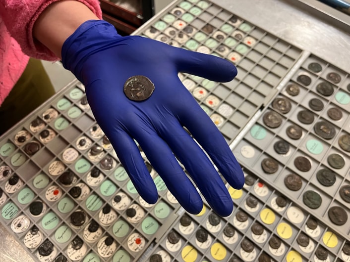 Ancient coin: On one side the coin bears the face of the god Melqart, resembling the Greek hero Herakles and wearing his famed lionskin headdress. At that time, some Phoenician coins carried Greek imagery to make them more appealing to traders.