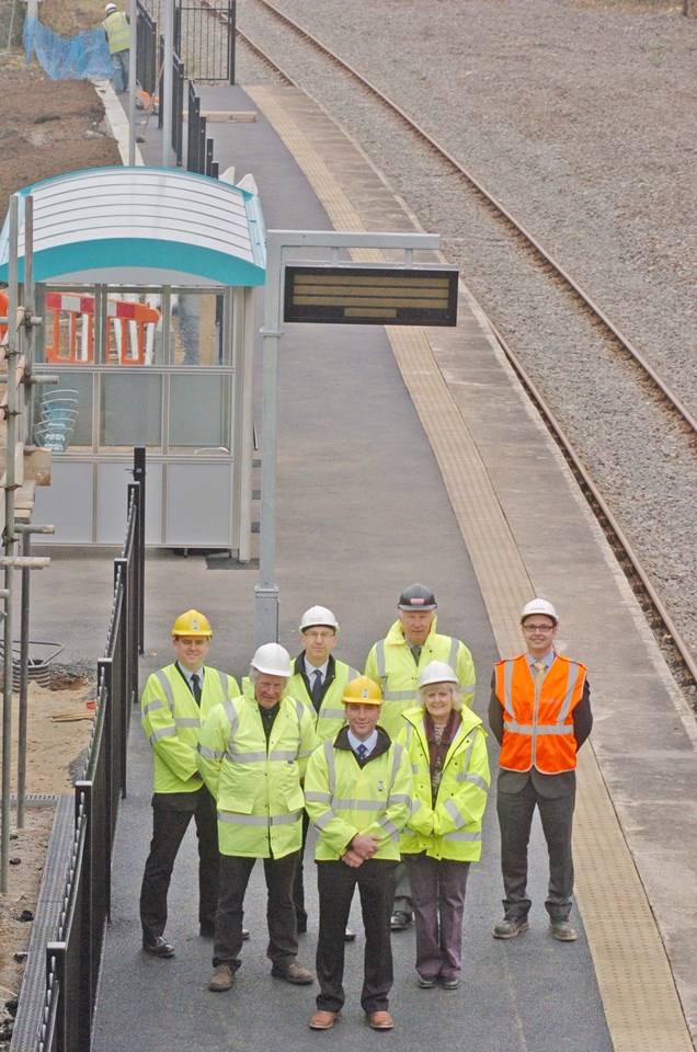 Project partners for Fishguard and Goodwick station: Councillor Jamie Adams (centre) is flanked by local Members, County Councillors Myles Pepper and Moira Lewis on the platform of the new station. Standing behind left to right are: Darren Thomas (the Council’s Head of Highways and Construction); Dylan Bowen (Network Rail Public Affairs manager); Peter Evans (construction director for Alun Griffiths Contractors Ltd) and Nick Murphy (principal engineer for engineering and design consultants, Atkins)