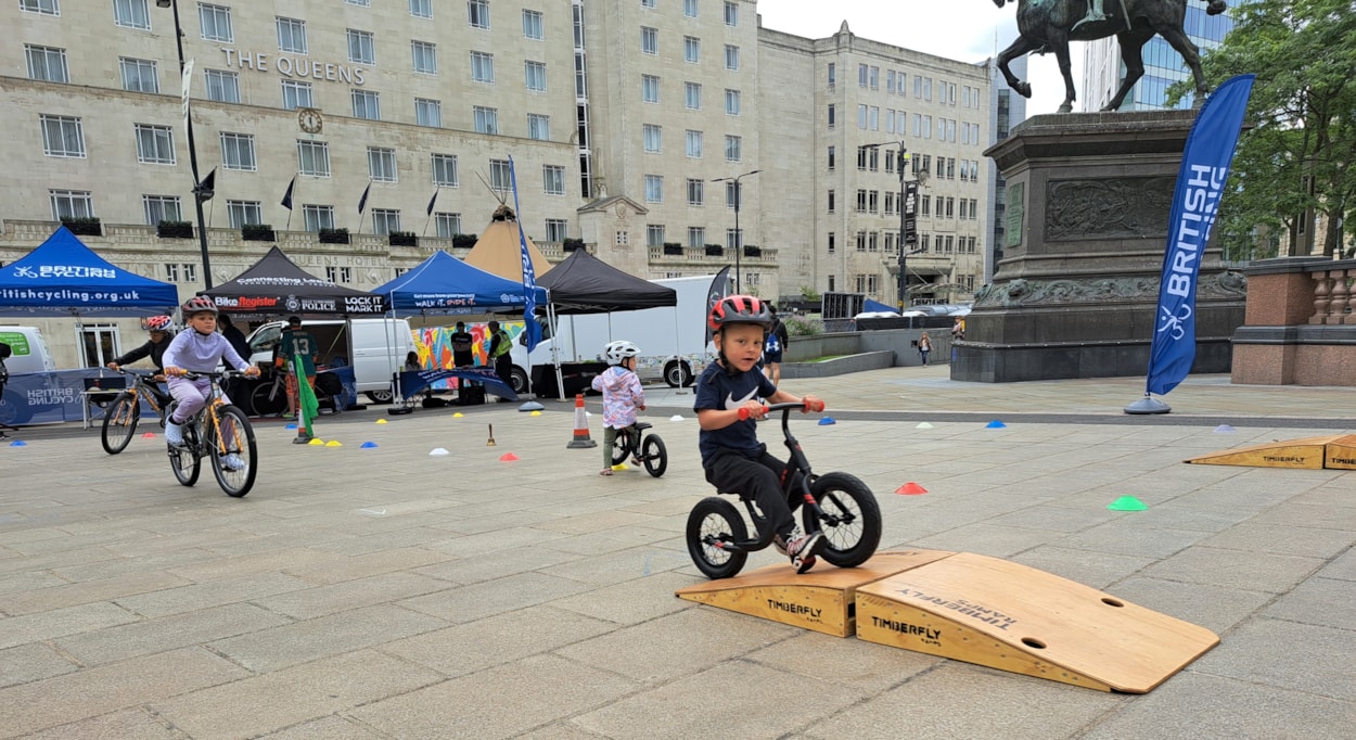 British cycling pump track: Young people riding bikes in City Square