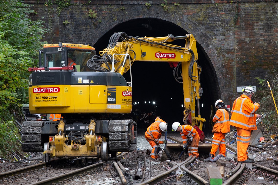 Salisbury Tunnel Junction - 111121: Track workers shovel old ballast where new sets of points will be laid just outside the tunnel.
Note: It's Fisherton Tunnel, but Salisbury Tunnel Junction.