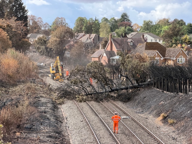 Network Rail teams removing fire damaged trees from the railway in Stourbridge: Network Rail teams removing fire damaged trees from the railway in Stourbridge
