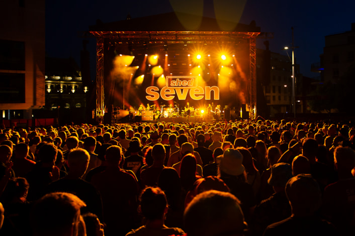 ShedSeven 25 @Mark Ratcliffe (1): Shed Seven stage and crowd shot from Millennium Square, Leeds (mandatory image credit for Mark Ratcliffe)