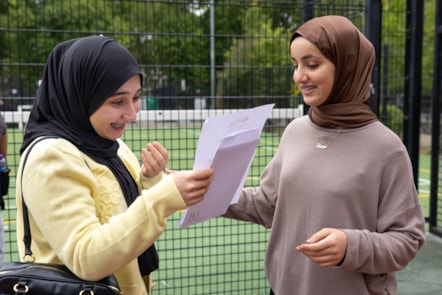 Donya, left, and Lamya celebrate their GCSE results at City of London Academy Highbury Grove