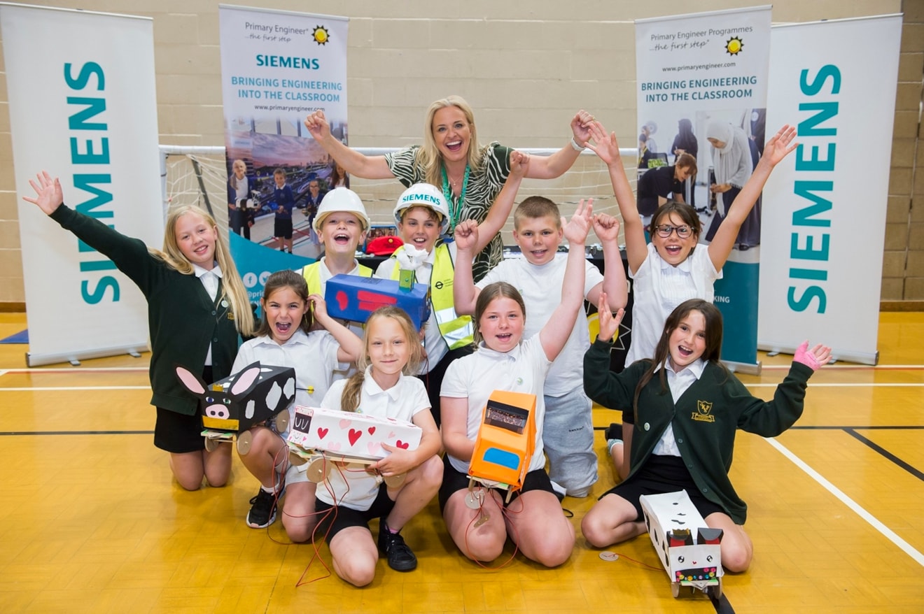 Children from Kingsway Primary School in Goole with Siemens Mobility Operations Support Manager Natalie Thornton at the Primary Engineer programme celebration event at Snaith Sports Hall