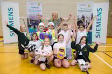 Children from Kingsway Primary School in Goole with Siemens Mobility Operations Support Manager Natalie Thornton at the Primary Engineer programme celebration event at Snaith Sports Hall: Children from Kingsway Primary School in Goole with Siemens Mobility Operations Support Manager Natalie Thornton at the Primary Engineer programme celebration event at Snaith Sports Hall