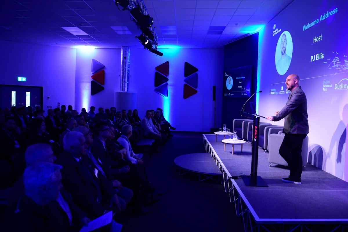 Host PJ Ellis addresses delegates at the Innovate Dudley Expo