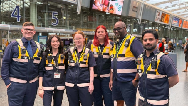 Staff in yellow vests - Manchester Piccadilly-3: Staff in yellow vests - Manchester Piccadilly-3