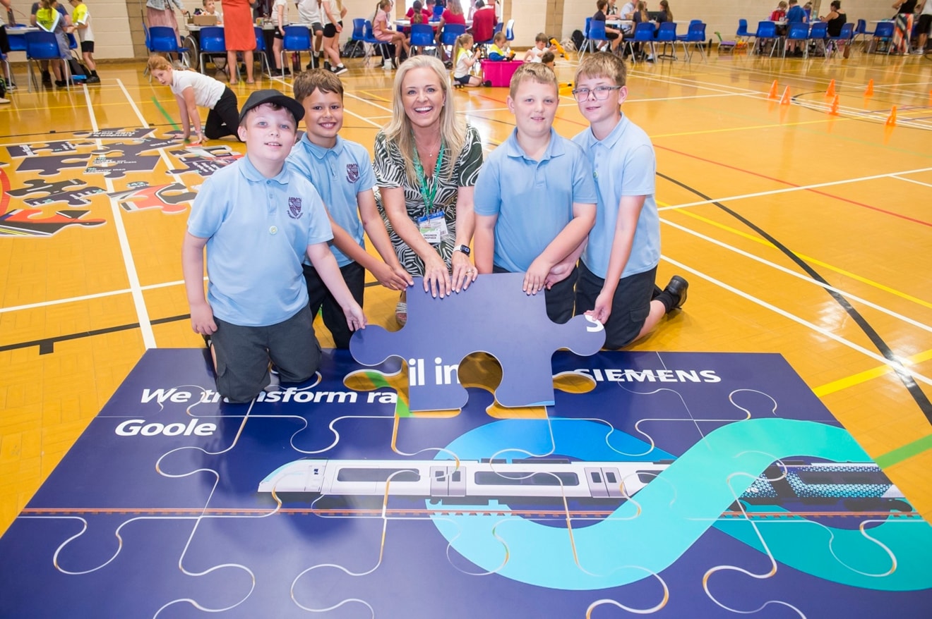 Siemens Mobility Operations Support Manager Natalie Thornton with pupils from Airmyn Park Primary School, one of the 13 schools from the Goole area who took part
