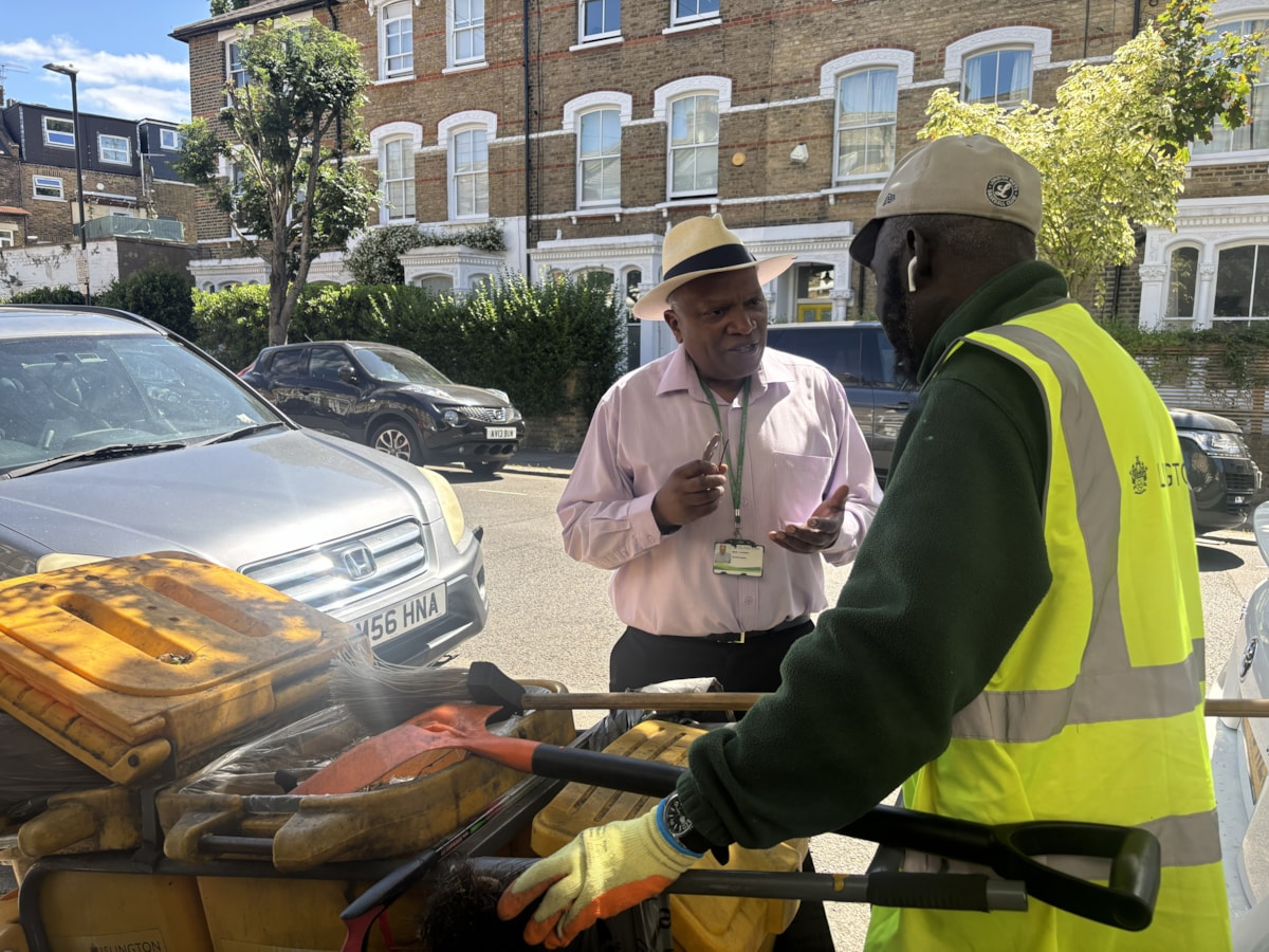 Mark Fontaine, Street Cleansing Operations Manager, taliing to a stret cleaning operative on a community walkabout
