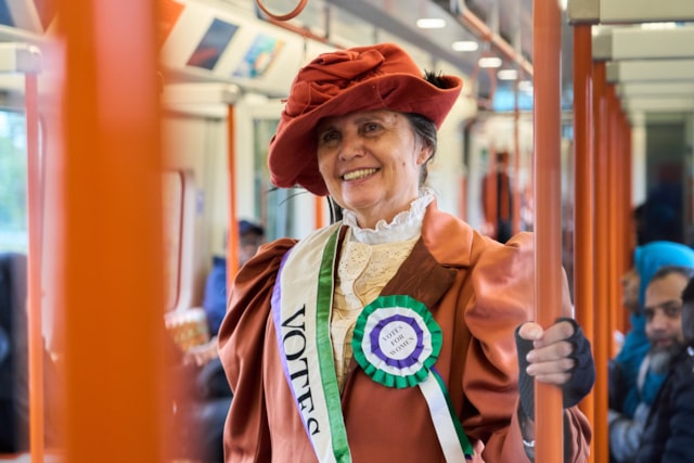 TfL Image - An actress from Zoom through History dressed as Suffragette leader, Emmeline Pankhurst joined them on what will become the Suffragette line