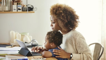 Mother and son at laptop