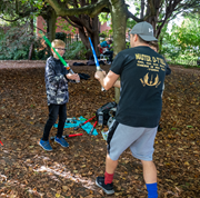 Party for Hilsea - Jedi training: Photo shows entertainer 'Master D-T'rill' performing Jedi training with a child.