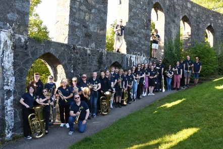Moray Concert Brass together with their instruments.
