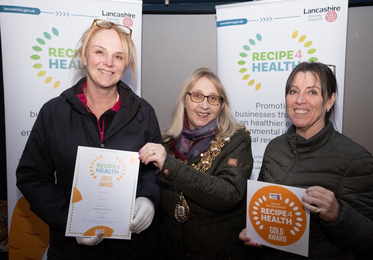 The Link staff are presented with the Gold Award by the Mayor