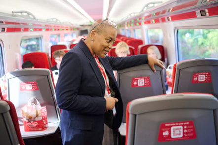LNER colleague talking on LNER Azuma