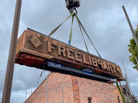 Woodside library entry sign