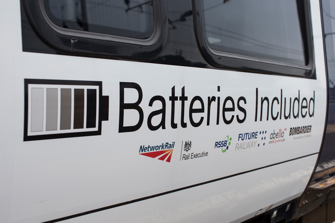 Logos on battery-powered train (IPEMU): The new train contributes to Network Rail’s commitment to reduce its environmental impact, improve sustainability and reduce the cost of running the railway by 20 per cent over the next five years. It could ultimately lead to a fleet of battery-powered trains running on Britain’s rail network which are quieter and more efficient than diesel-powered trains, making them better for passengers and the environment. Network Rail and its industry partners – including Bombardier, Abellio Greater Anglia, FutureRailway and the Rail Executive arm of the Department for Transport (which is co-funding the project) – recognise the potential for battery-powered trains to bridge gaps between electrified parts of the network and to run on branch lines where it would be too expensive to install overhead electrification.