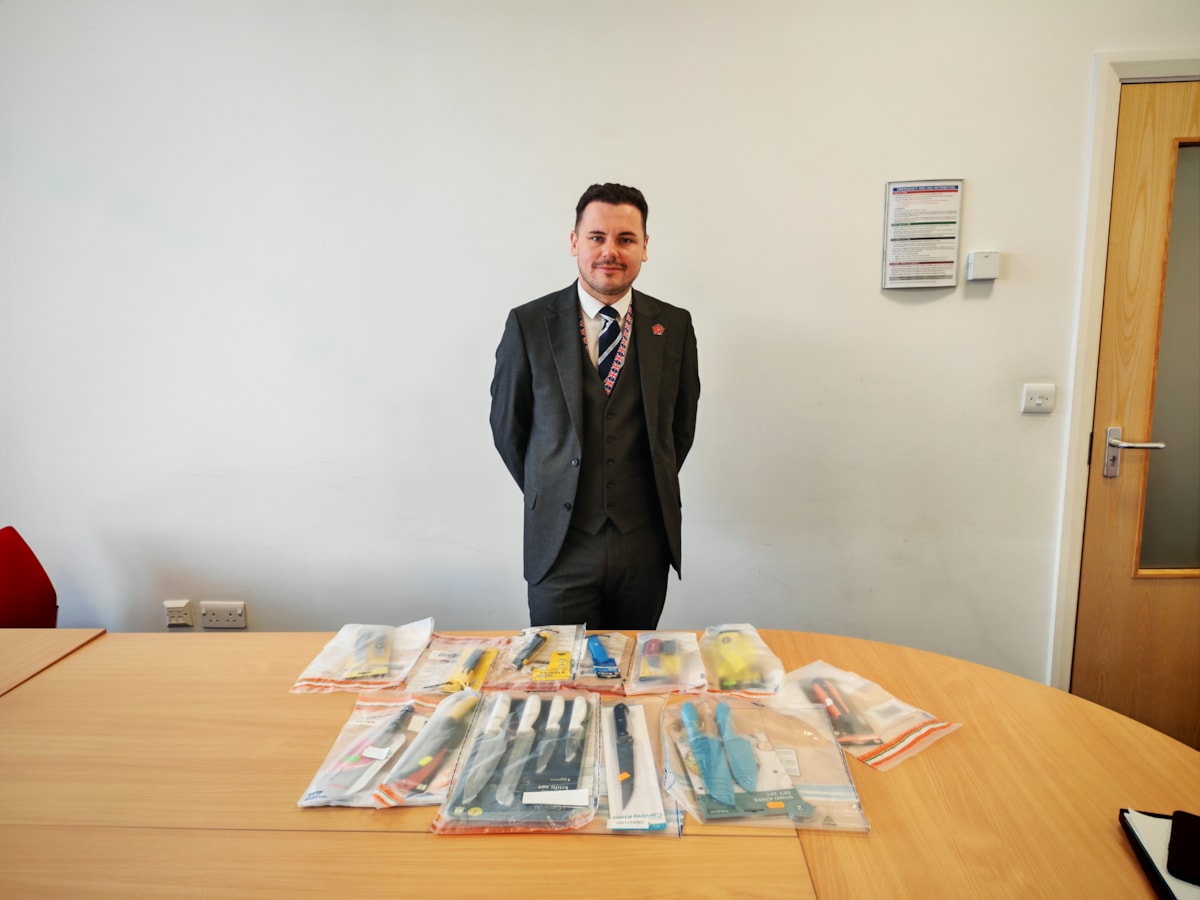 Cllr Joshua Roberts with some of the knives seized during Sceptre-2