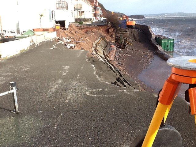 Media update: flooding and landslip block routes to Exeter: Work underway at Dawlish, showing the scrapped rails and the first spray of concrete