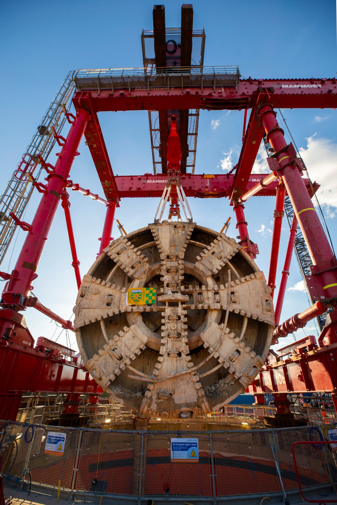 TBM Sushila removed after completing 5-mile journey to construct HS2's Northolt Tunnel under the capital-5: Following its 5-mile drive underneath the capital, HS2 lifted Tunnel Boring Machine (TBM) ‘Sushila’ out of the ground at the Green Park Way site in Greenford, West London.
 
The cutterhead, front and middle shield, weighting 880 tonnes, were lifted from the vent shaft in one piece on Saturday, March 15, using a 750 tonne gantry crane. The TBM – with a cutterhead spanning 9.48 metres in diameter – was launched from West Ruislip in October 2022 and completed its journey in December 2024. TBM Sushila excavated over 1.2 million tonnes of earth and installed 4,217 tunnel rings.
 
TBM Sushila was used to construct part of the Northolt Tunnel – an 8.4-mile tunnel being built by four TBMs which will take HS2 trains from Old Oak Common Station to the outskirts of the capital.

Copyright - HS2 Ltd