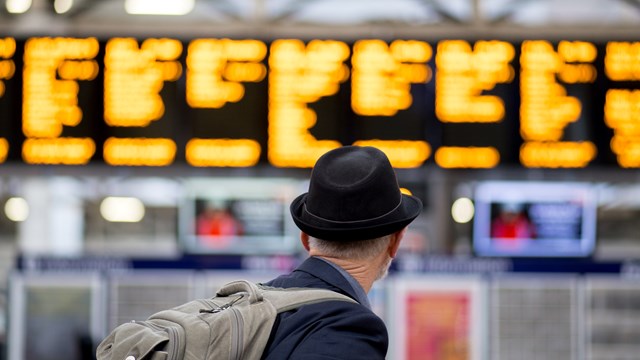 Passengers in the west and across Wales are urged to check before travelling this Christmas and New Year as Network Rail carries out festive upgrades: Passenger at departure board