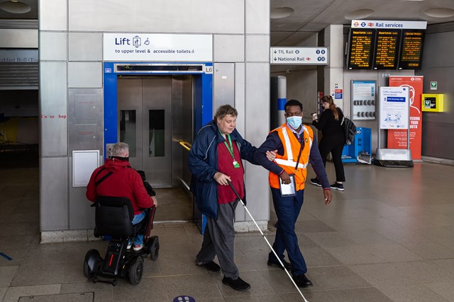 TfL Image - TfL staff assists customer