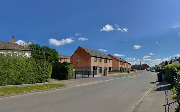 Kingsdale Leeds 2: A computer-generated image - looking east on Boggart Hill Road - showing how part of the housing development proposed for the former Kingsdale Court site in Seacroft, Leeds, could shape up.