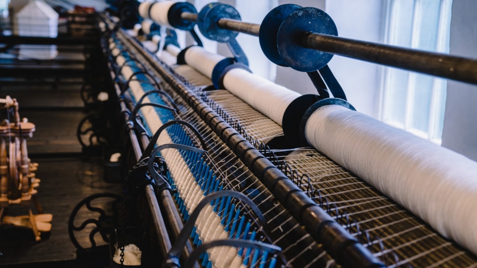 A close up of the weaving loom at the Weaving Shed in the museum.
