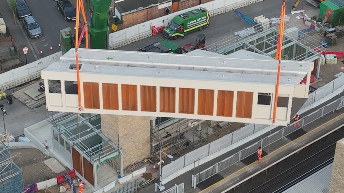 Footbridge section lifted into place at Hither Green