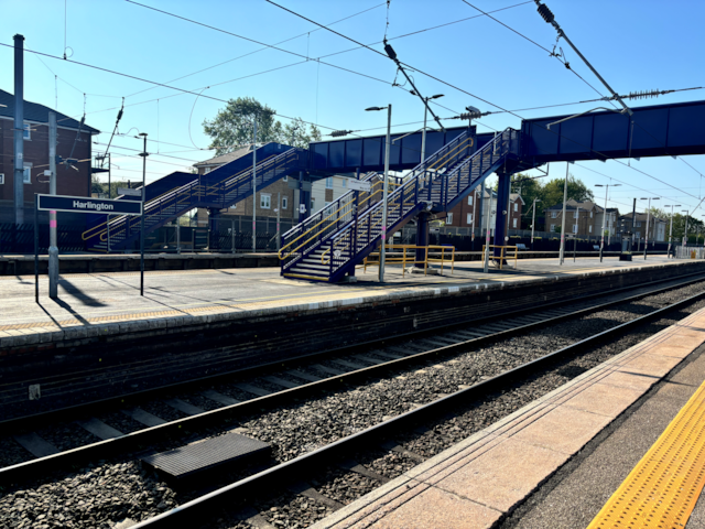 Wide shot of bridge and sign: Wide shot of bridge and sign