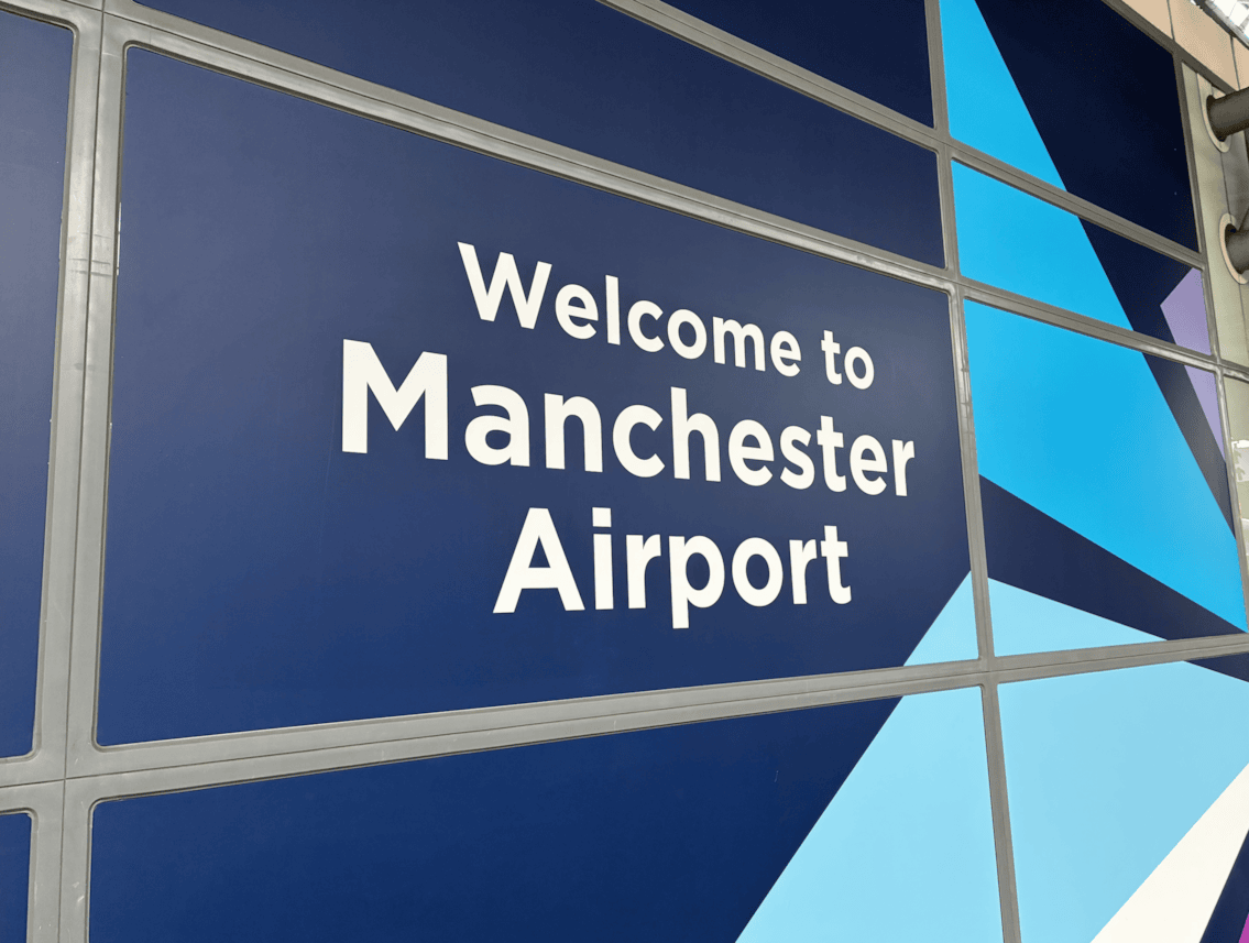 Welcome to Manchester Airport station sign