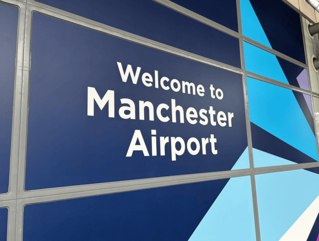 Welcome to Manchester Airport station sign