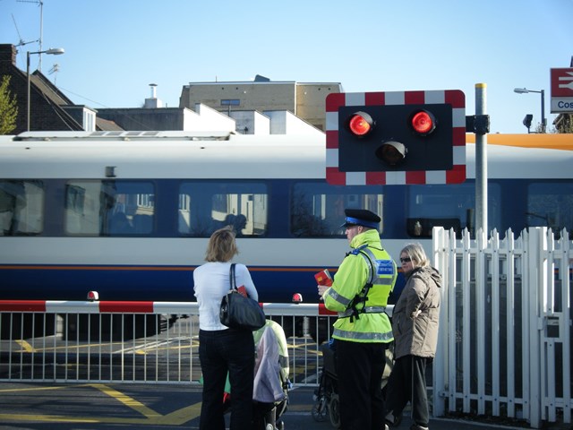 Level Crossing Awareness Day - Cosham: British Transport Police office issues a leaflet to pedestrians in Cosham asking 