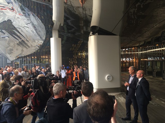 Chris Montgomery, project director for Network Rail, hands over the keys to the station to Patrick Power, station manager, at the opening of Birmingham New Street