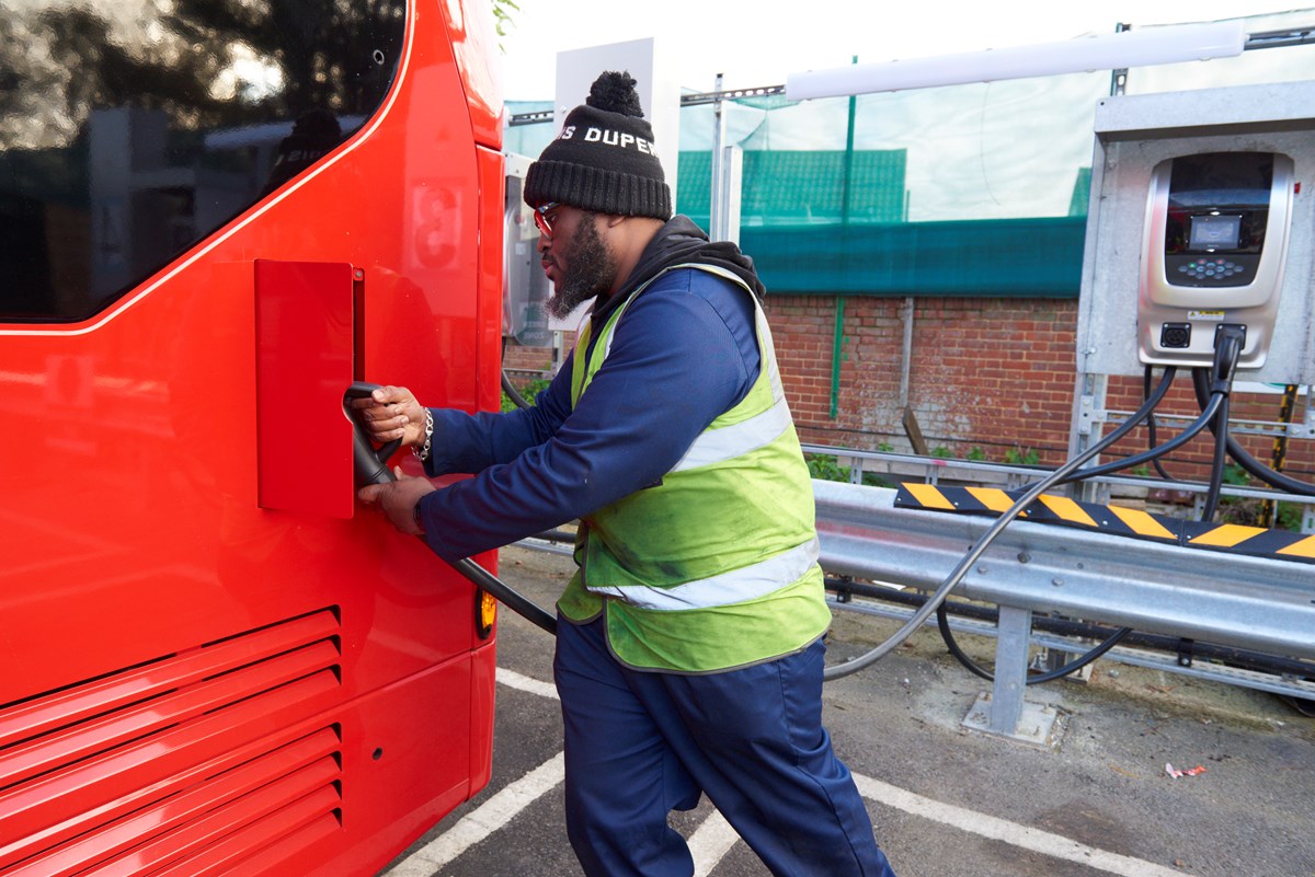 An apprentice engineer, Darren Abbey, charges a zero emission electric bus at Go-Ahead's Bexleyheath depot in south-east London.