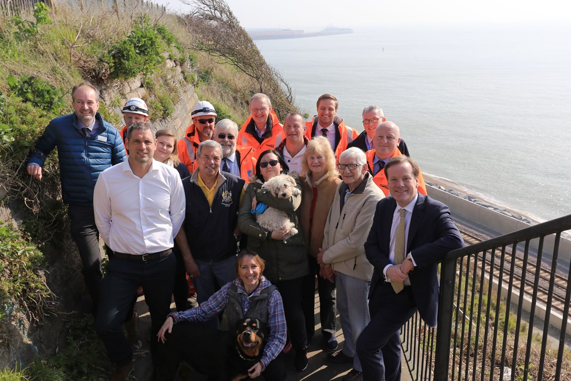 Dover - Shakespeare Beach: Network Rail, Costain and Kent County Council, MP Charlie Elphicke, Channel Swimmers, dog walkers and their dogs celebrate the opening of Shakespeare Beach and the new footbridge to it in Dover