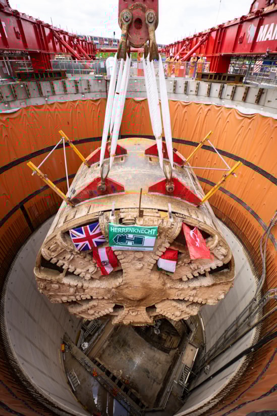 TBM Caroline lifted out of vent shaft at Green Park Way, Greenford - May 2025-6: HS2 lifts Tunnel Boring Machine (TBM) ‘Caroline’ from below ground at the Green Park Way site in Greenford, West London.
On Sunday 25th May, engineers working on the HS2 project lifted the TBM 9.48metre diameter cutterhead, front and middle shield, weighing 850 tonnes, using a large gantry crane. The tunnelling machine concluded its 5mile journey from West Ruislip in April, arriving in an underground reception chamber. TBM Caroline excavated over 1.2 million tonnes of earth and installed 4,217 tunnel rings.