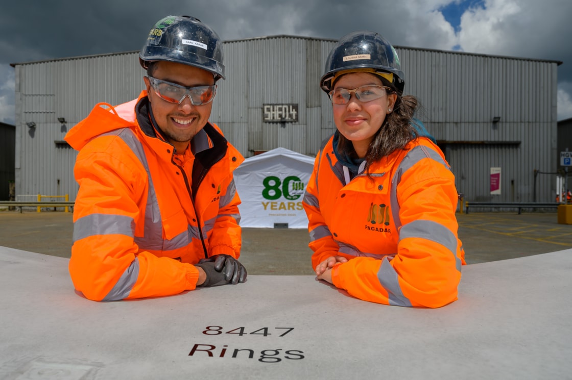 Husband and wife, Saad and Loubna, who cast final HS2 tunnel segment at PACADAR UK Isle of Grain factory-2: Saad Aarab and Loubna Samih from PACADAR posing with one of the final ring segments for HS2 London Tunnels, at the PACADAR factory on the Isle of Grain in Kent. PACADAR are manufacturing the London Tunnel segments as a sub-contractor for our London tunnels contractor, Skanska Costain Strabag (SCS) joint venture.