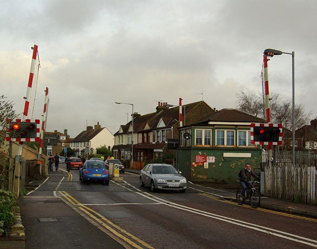Motorists pass through the crossing as red light warning sequence begins: Motorists pass through the crossing as red light warning sequence begins